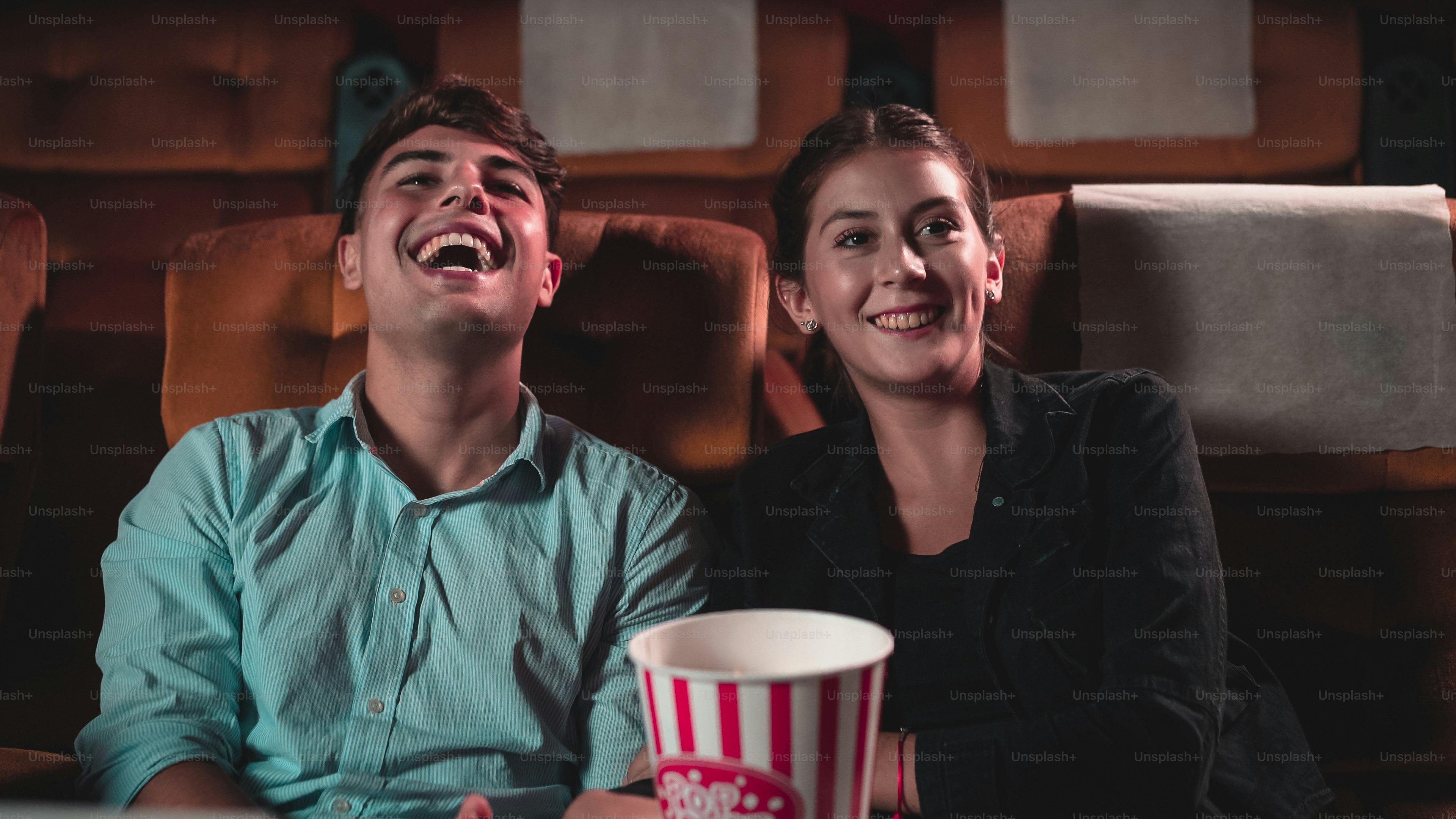 People audience watching movie in the movie theater cinema. Group recreation activity and entertainment concept