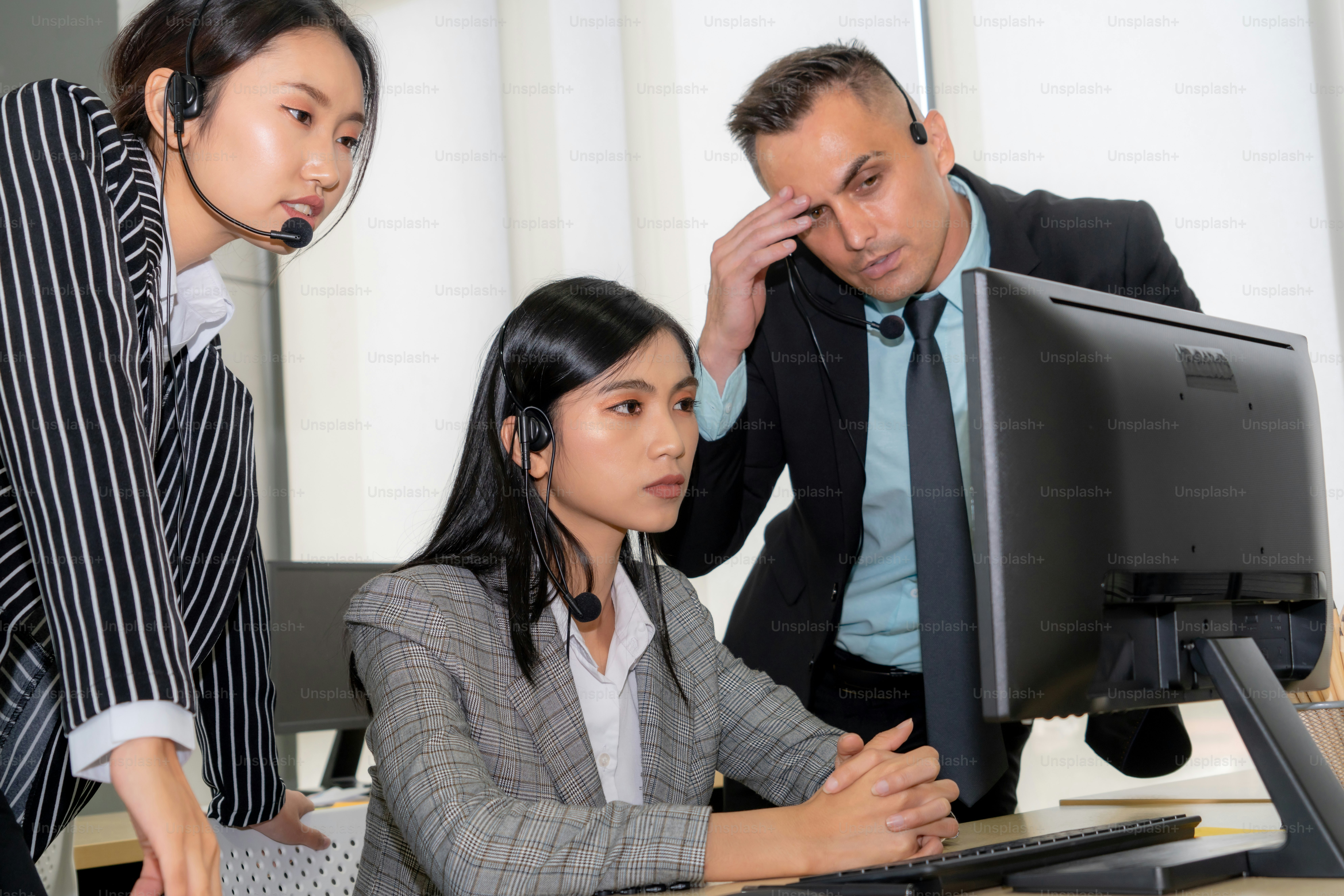 Business people wearing headset feel unhappy working in office . Failure negative sadness emotion concept of call center, telemarketing and customer support crisis in financial economy down fall .