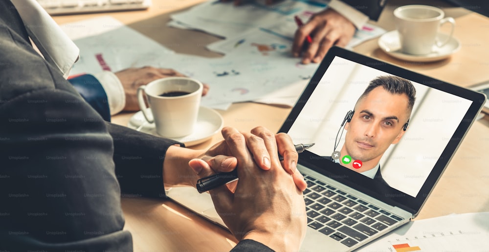 Video call group business people meeting on virtual workplace or remote office. Telework conference call using smart video technology to communicate colleague in professional corporate business.