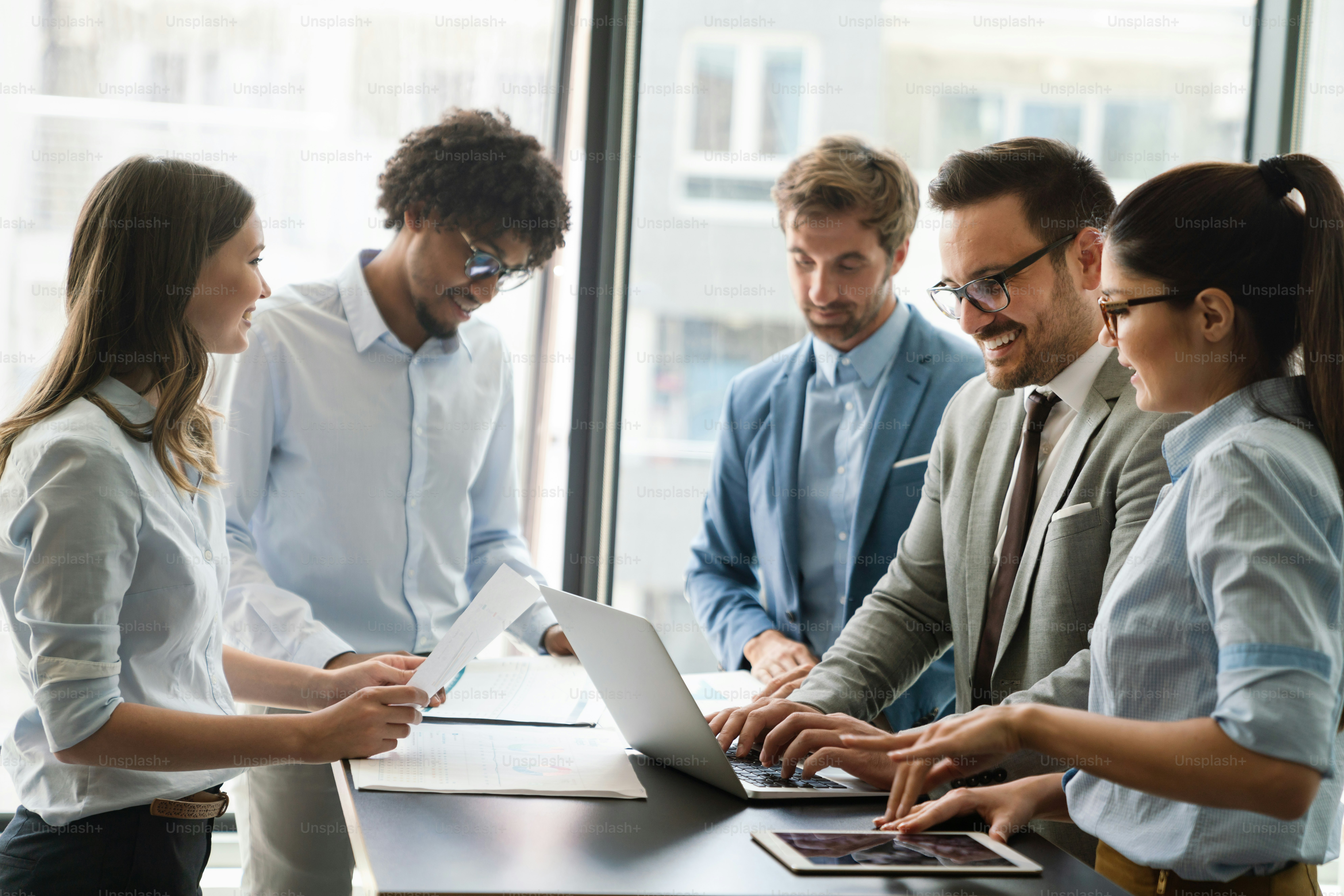 Portrait of successful business team working together in office