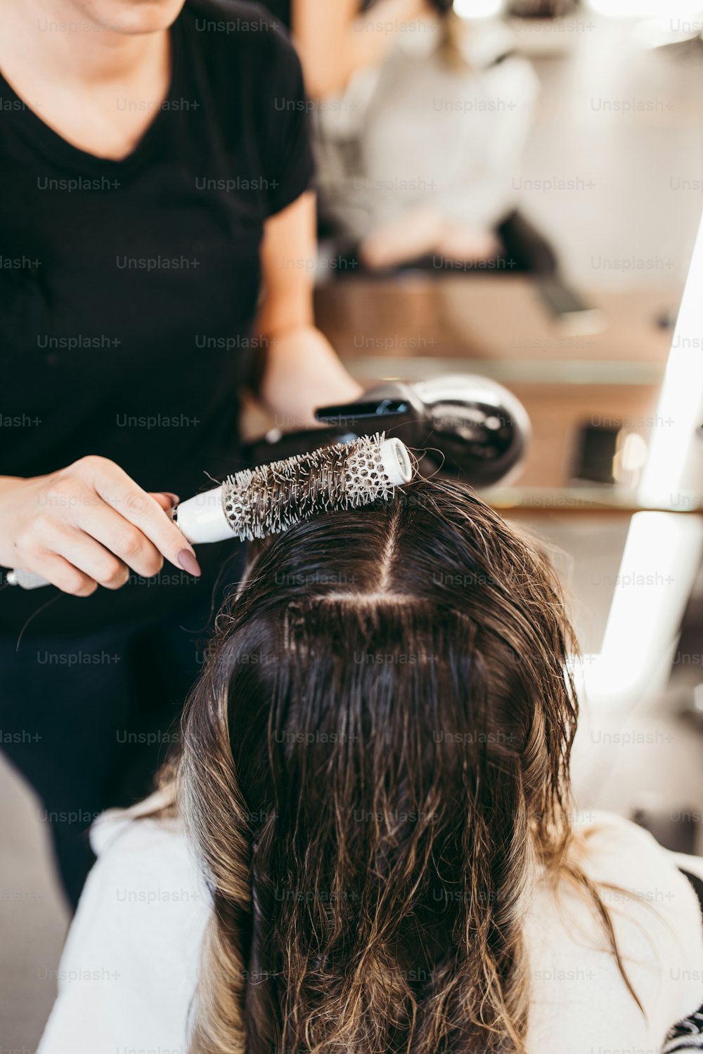 Beautiful brunette woman with long hair at the beauty salon getting a hair  blowing. Hair salon styling concept. photo – Hair Image on Unsplash