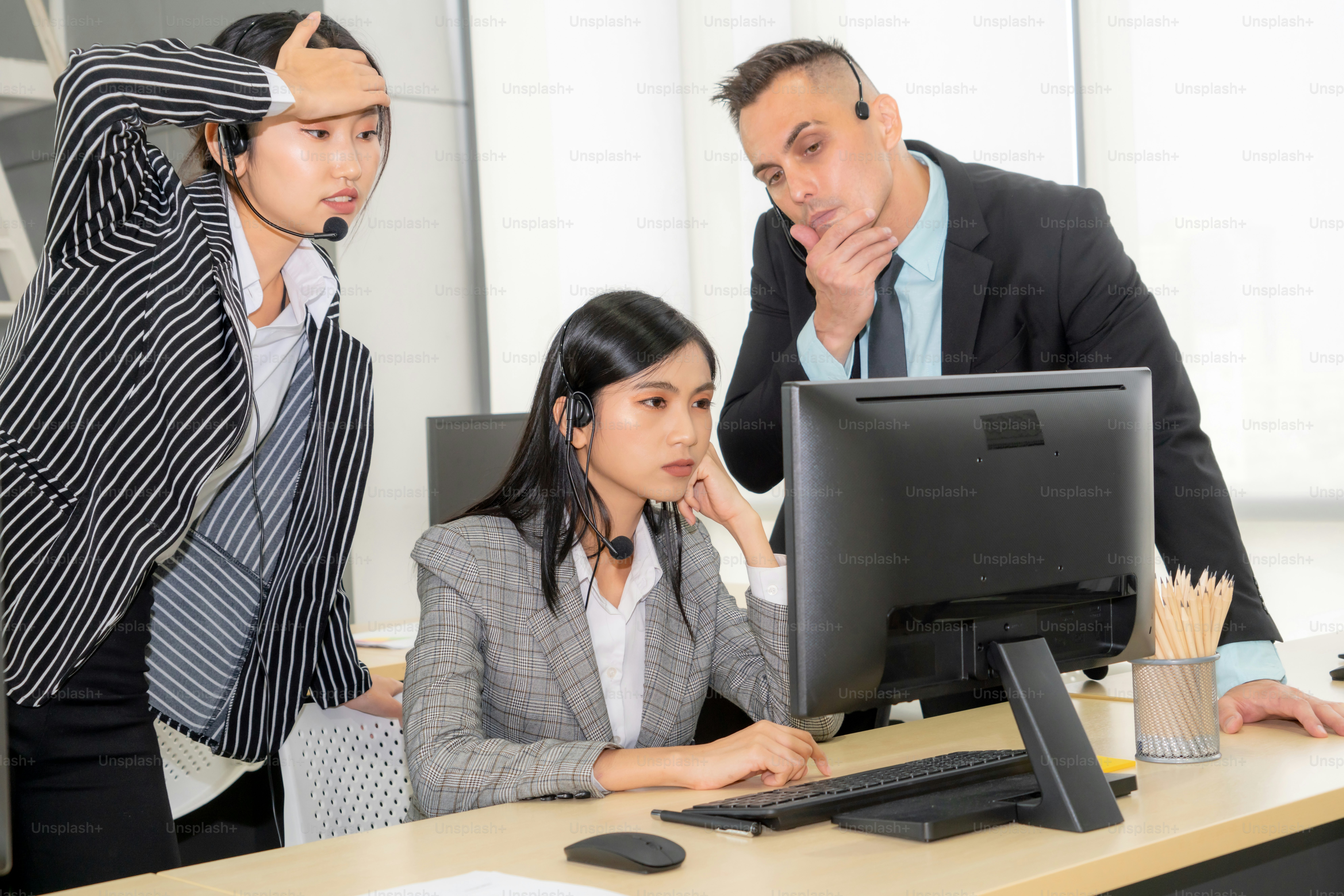 Business people wearing headset feel unhappy working in office . Failure negative sadness emotion concept of call center, telemarketing and customer support crisis in financial economy down fall .