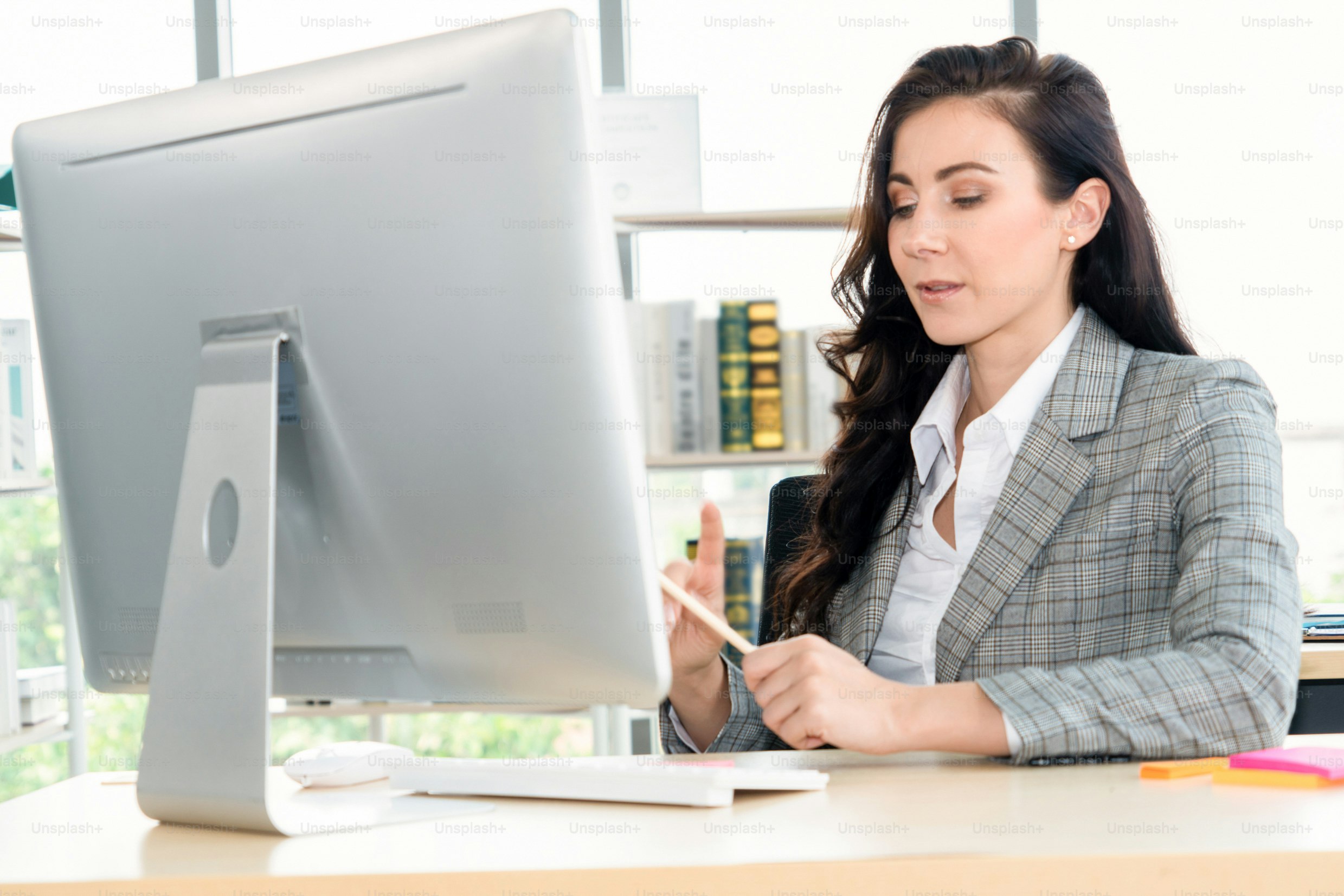 Business people working at table in modern office room while analyzing financial data report .