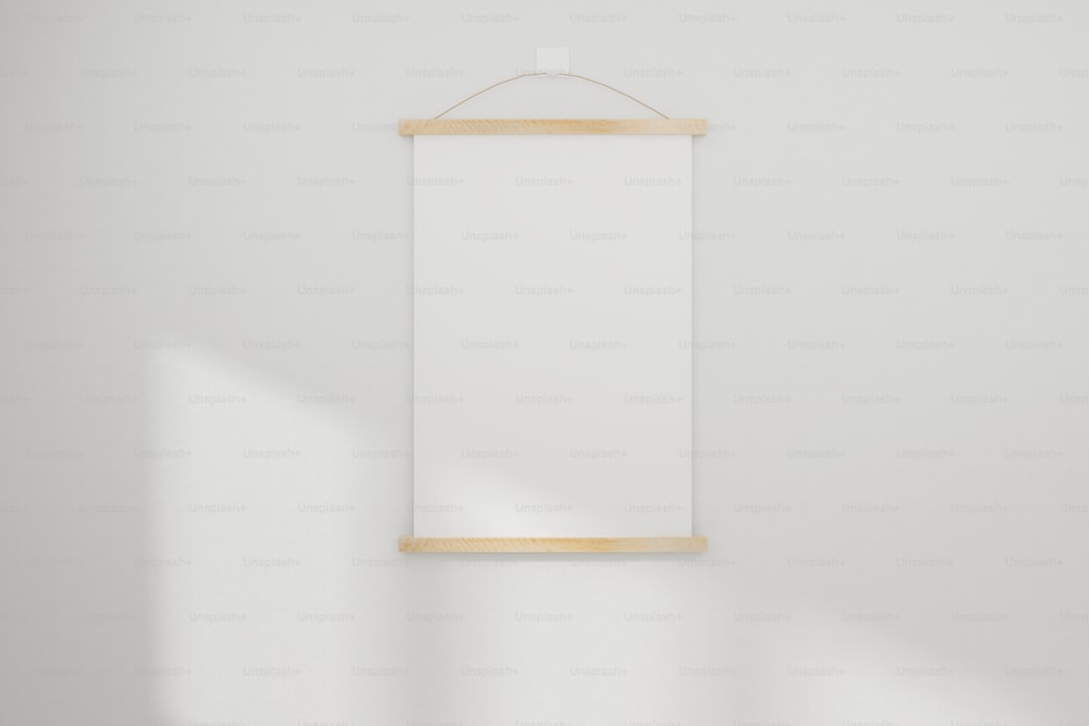 Mockup white realistic empty picture frame on white wall background. 3D Rendered.