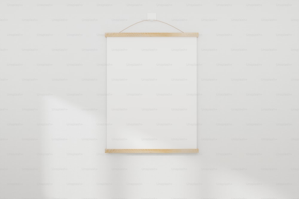 Maqueta de marco de imagen vacío realista blanco sobre fondo de pared blanco. Renderizado en 3D.
