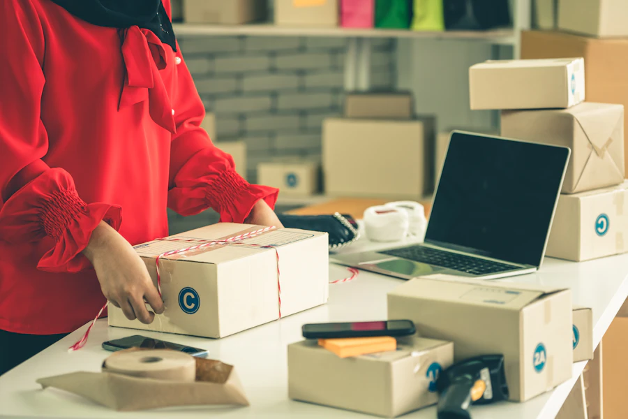 Online seller packing orders into shipping boxes