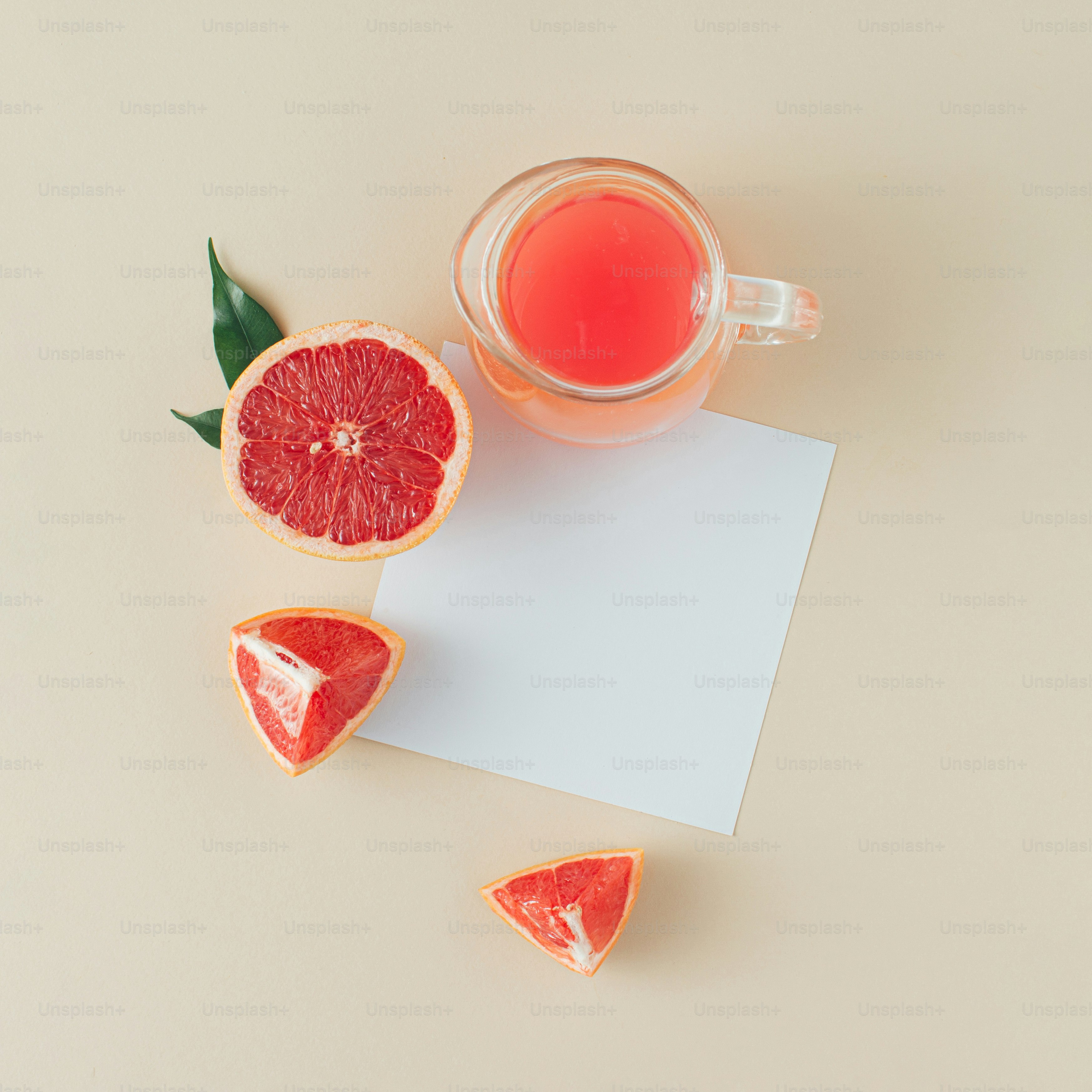 Jar of grapefruit juice with slices of grapefruit and paper card note