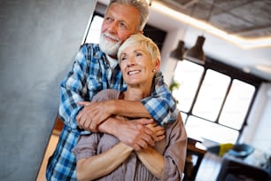 Cheerful happy senior couple enjoying life and spending time together