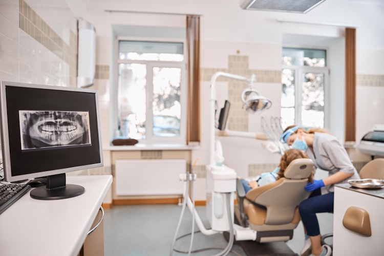 A modern dental office with chair and operatory equipment