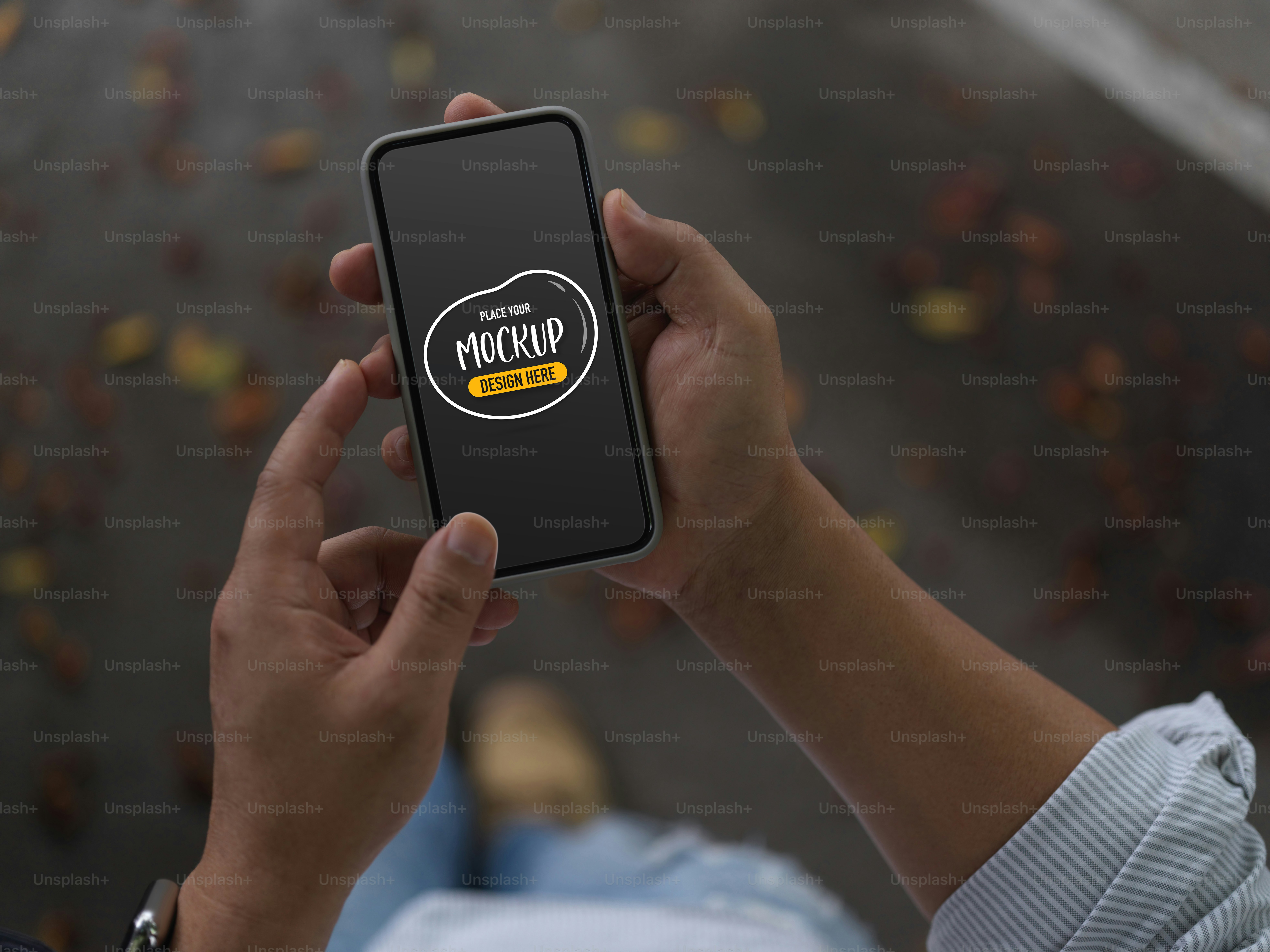 Cropped shot of male using mock up smartphone while walking on street