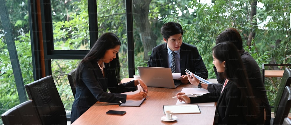 Businesspeople are working together in a comfortable conference room.