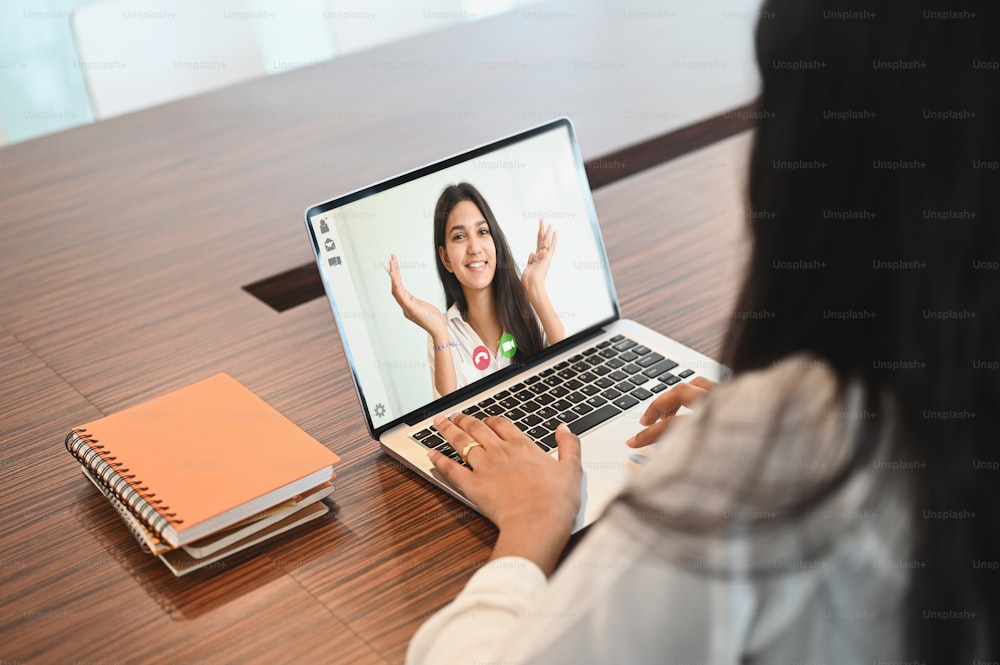 Closeup business woman talking to her colleagues video conference.