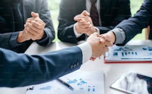 Businessman shaking hands agreement confirmed in the investment business.