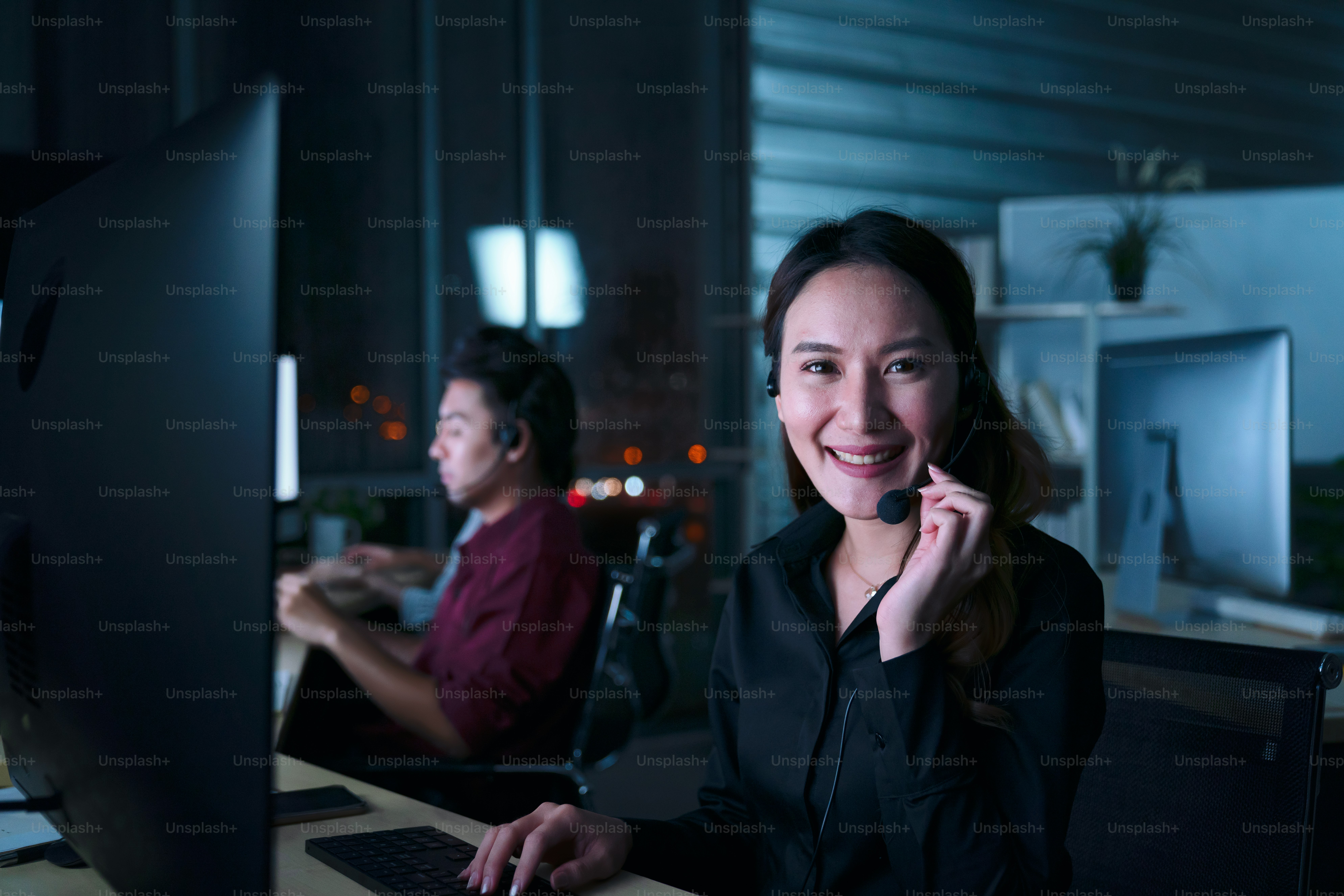 Top view young customer services care operators working night shift in ...