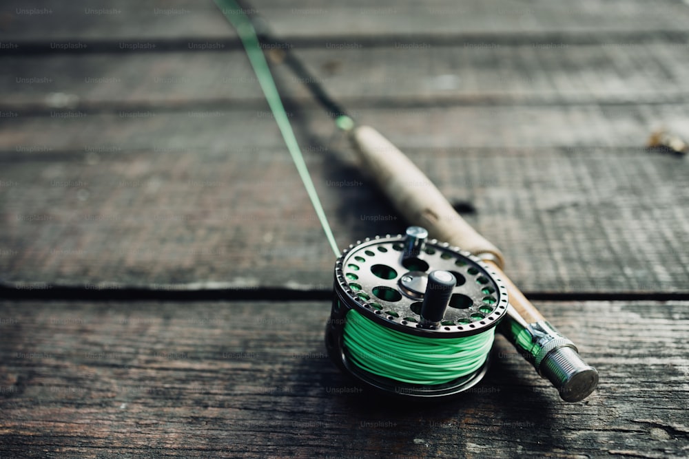Wallpaper or texture of fly fishing rod lying on old wooden table. High  angle view. photo – Nature Image on Unsplash