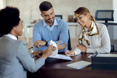 Insurance agent reviewing documents with a client