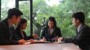Businesspeople discussing together in conference room  at office.
