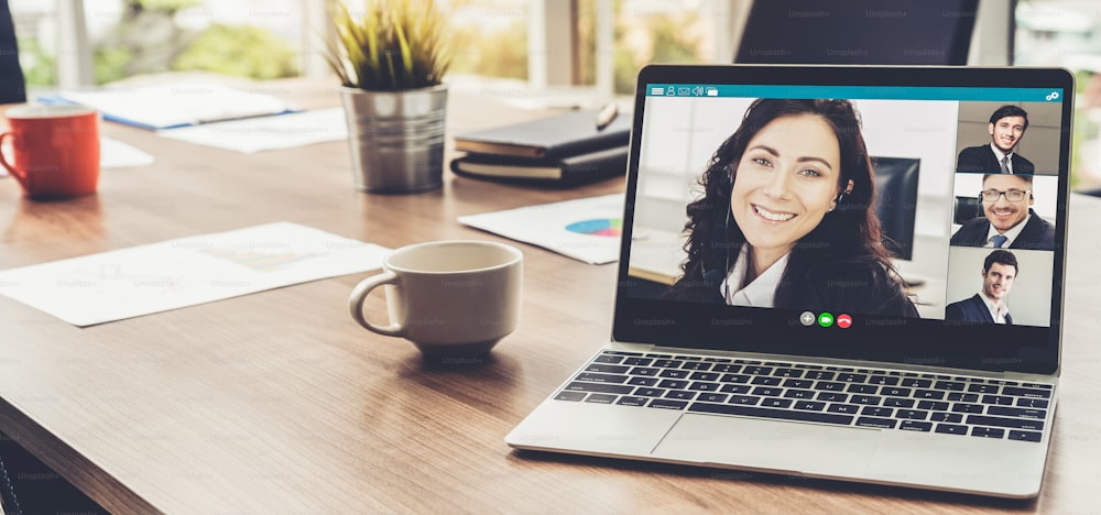 Video call business people meeting on virtual workplace or remote office. Telework conference call using smart video technology to communicate colleague in professional corporate business.