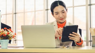 Business people working at table in modern office room while analyzing financial data report .