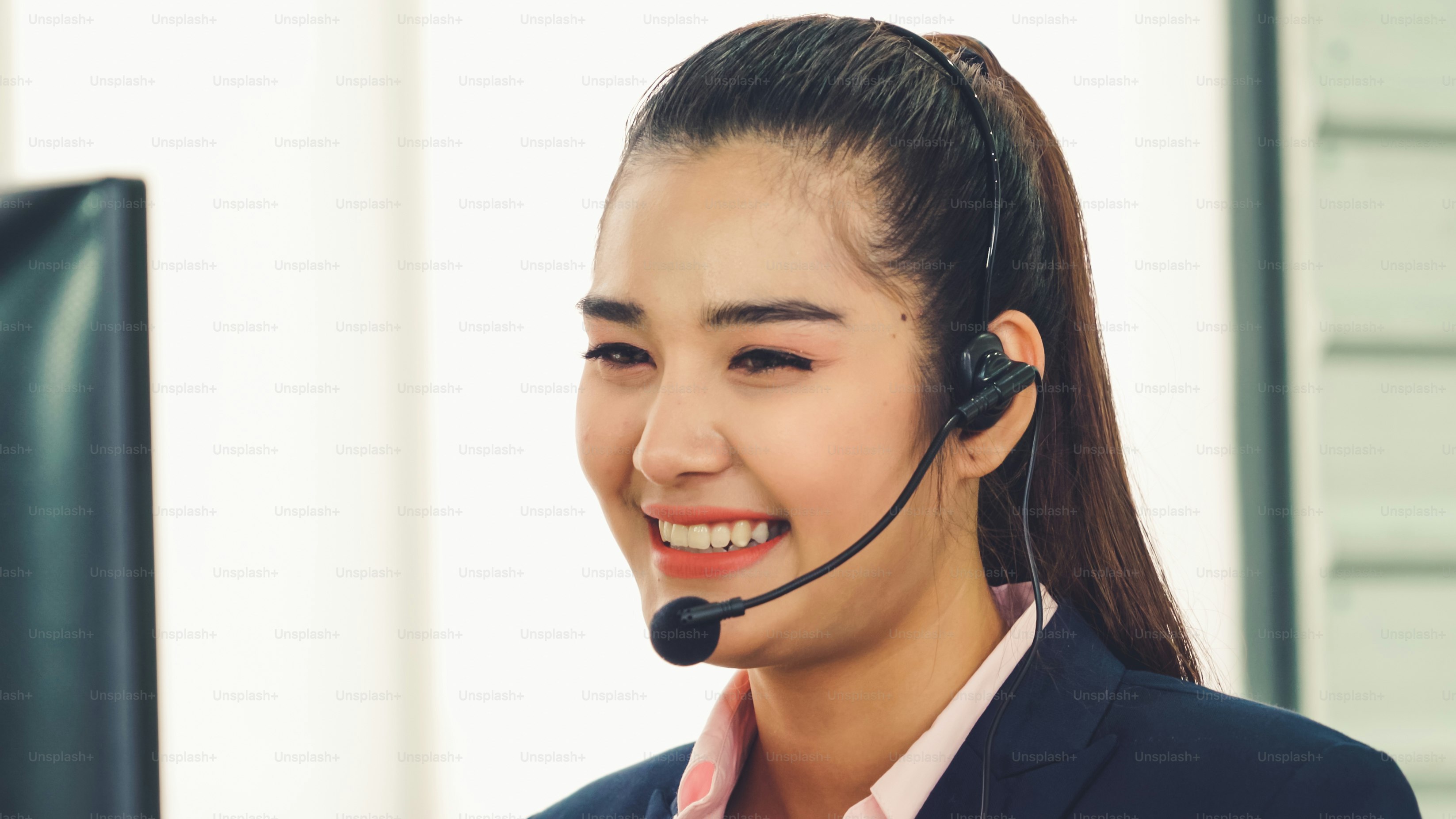 Business people wearing headset working in office to support remote customer or colleague. Call center, telemarketing, customer support agent provide service on telephone video conference call.
