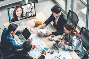 Video call group business people meeting on virtual workplace or remote office. Telework conference call using smart video technology to communicate colleague in professional corporate business.