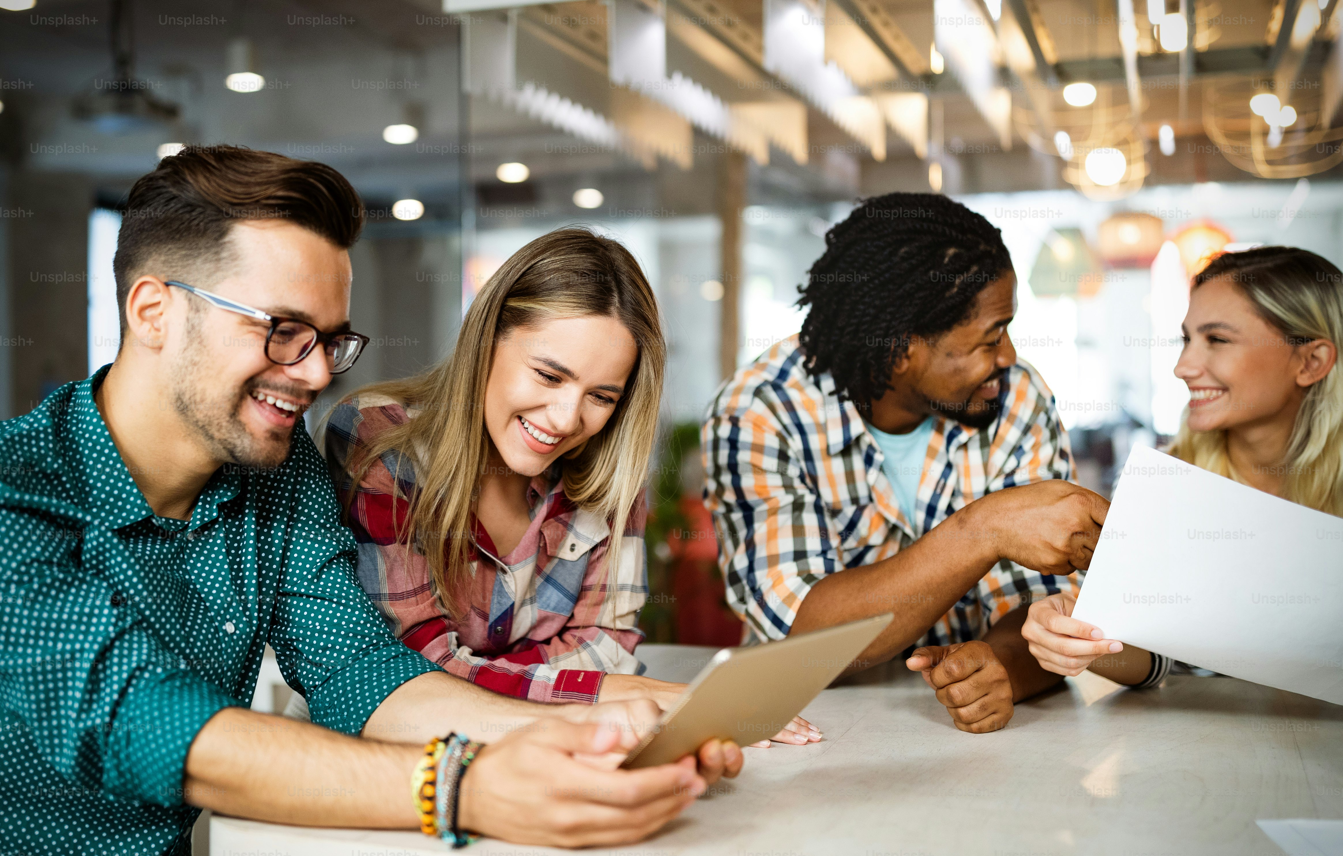 Business people having fun, brainstorming and chatting at workplace office