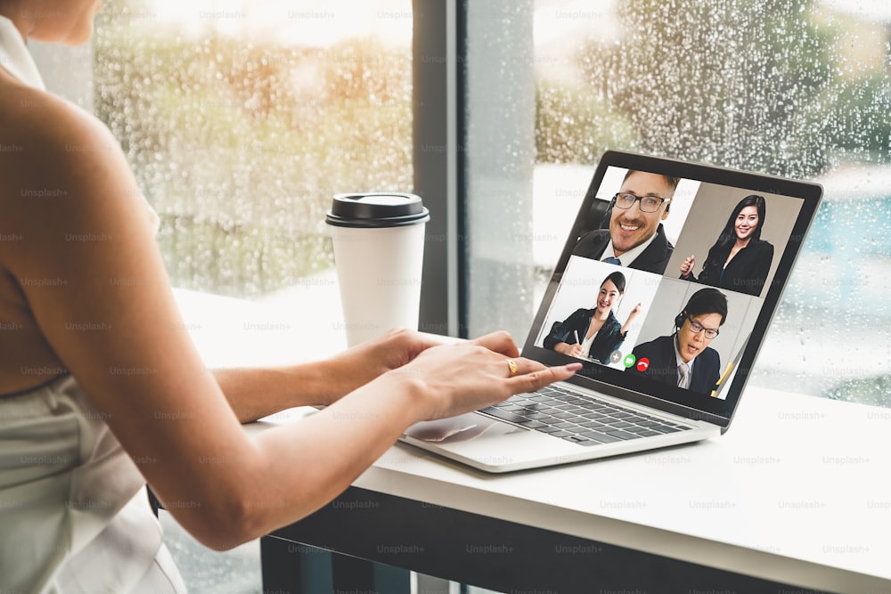 Video call business people meeting on virtual workplace or remote office. Telework conference call using smart video technology to communicate colleague in professional corporate business.