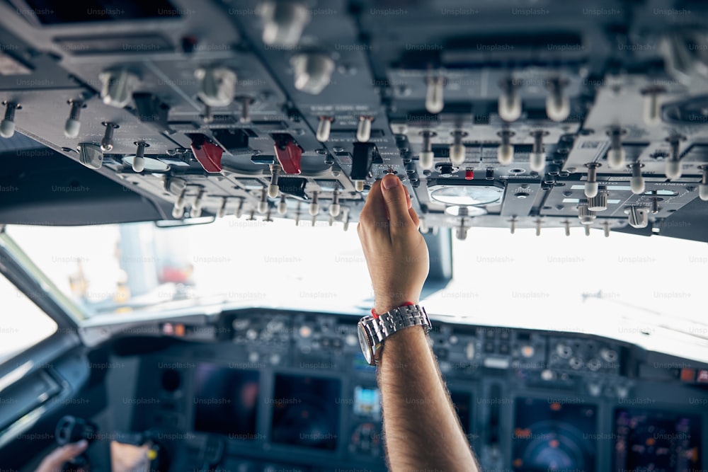 Close up portrait of high detailed view on engine power control in the cockpit of modern civil passenger airplane