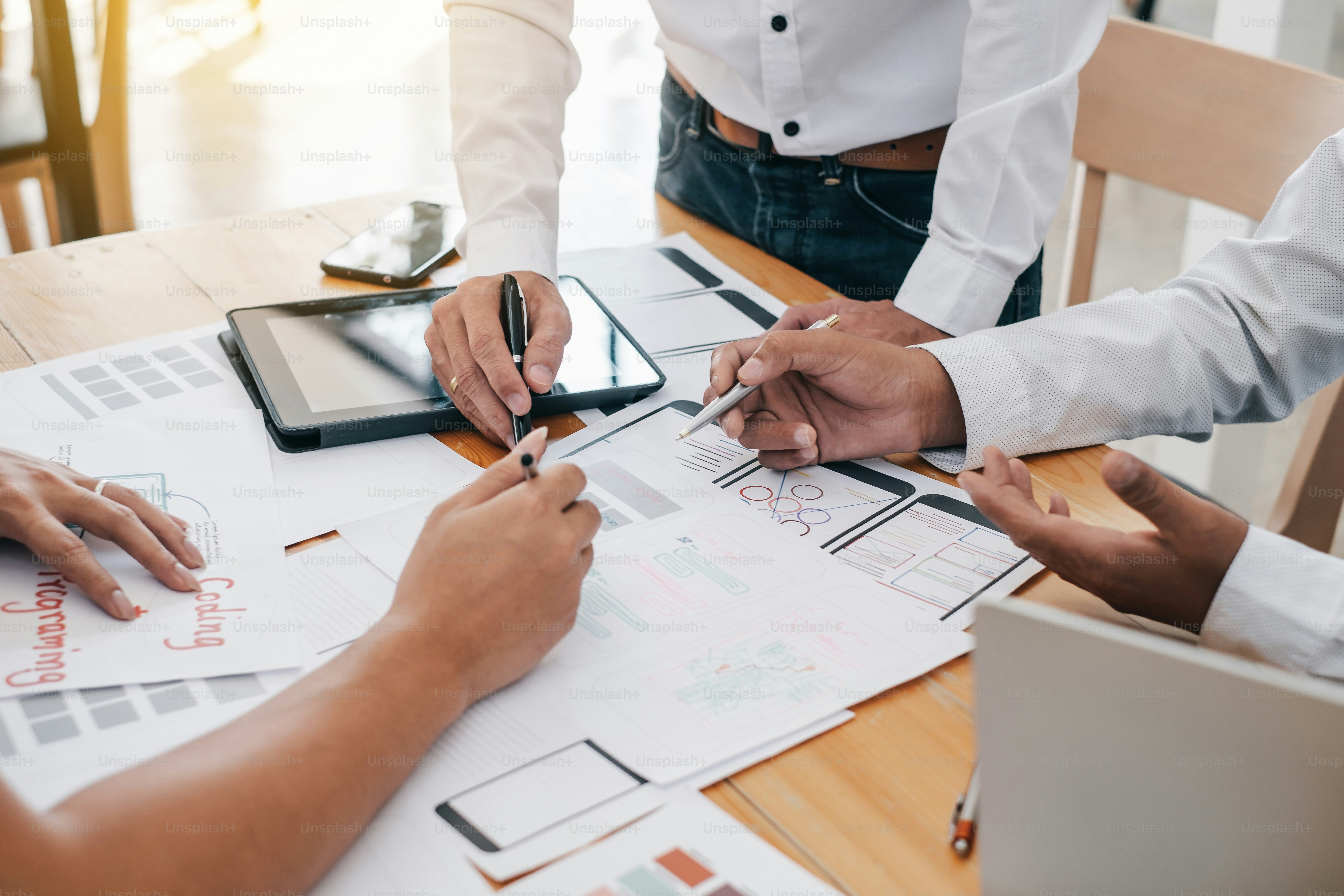 Teamwork graphic designers creative drawing website ux-ui app development and application for mobile office.