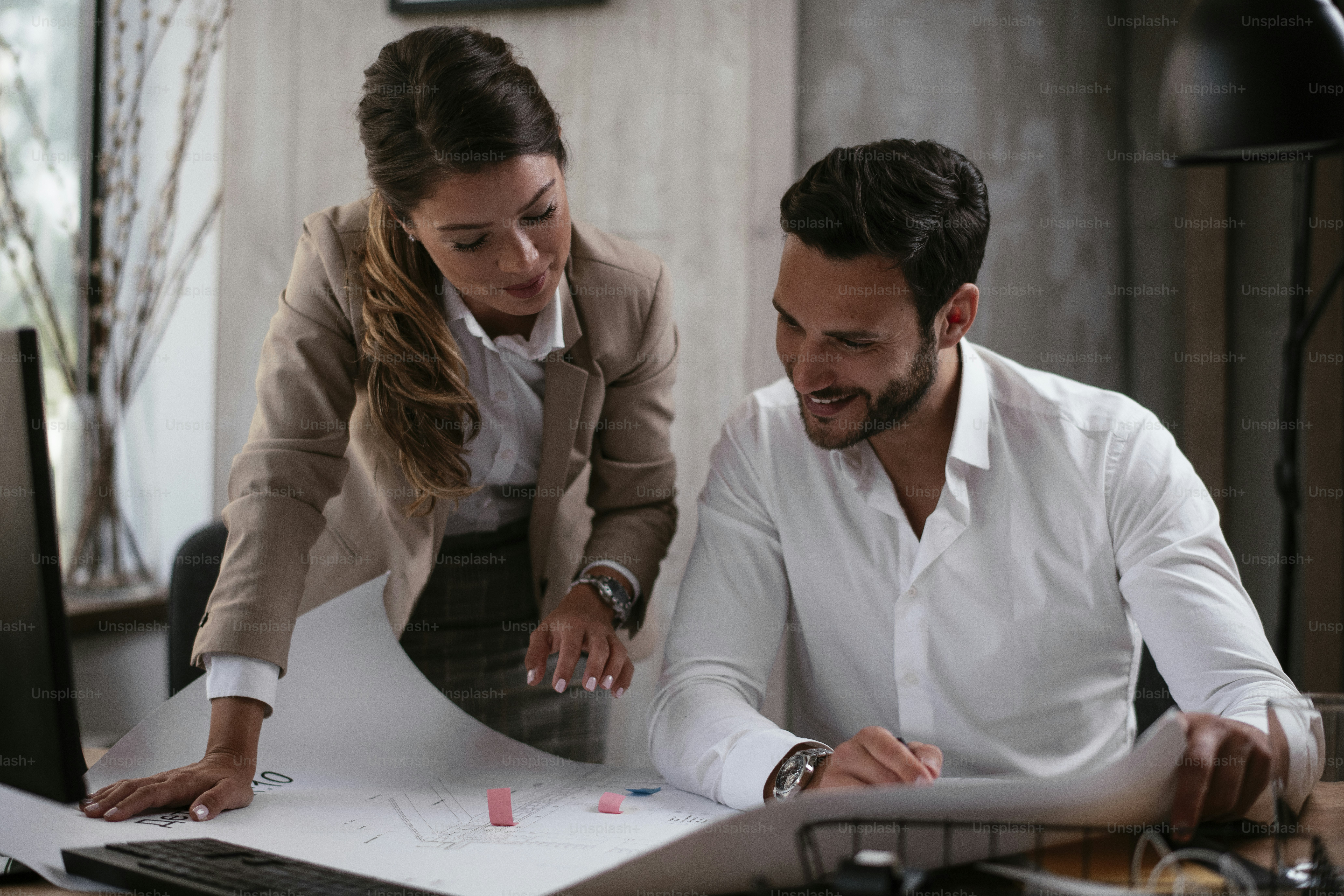 Businessman and businesswoman in office. Businesswoman and businessman working on the project.