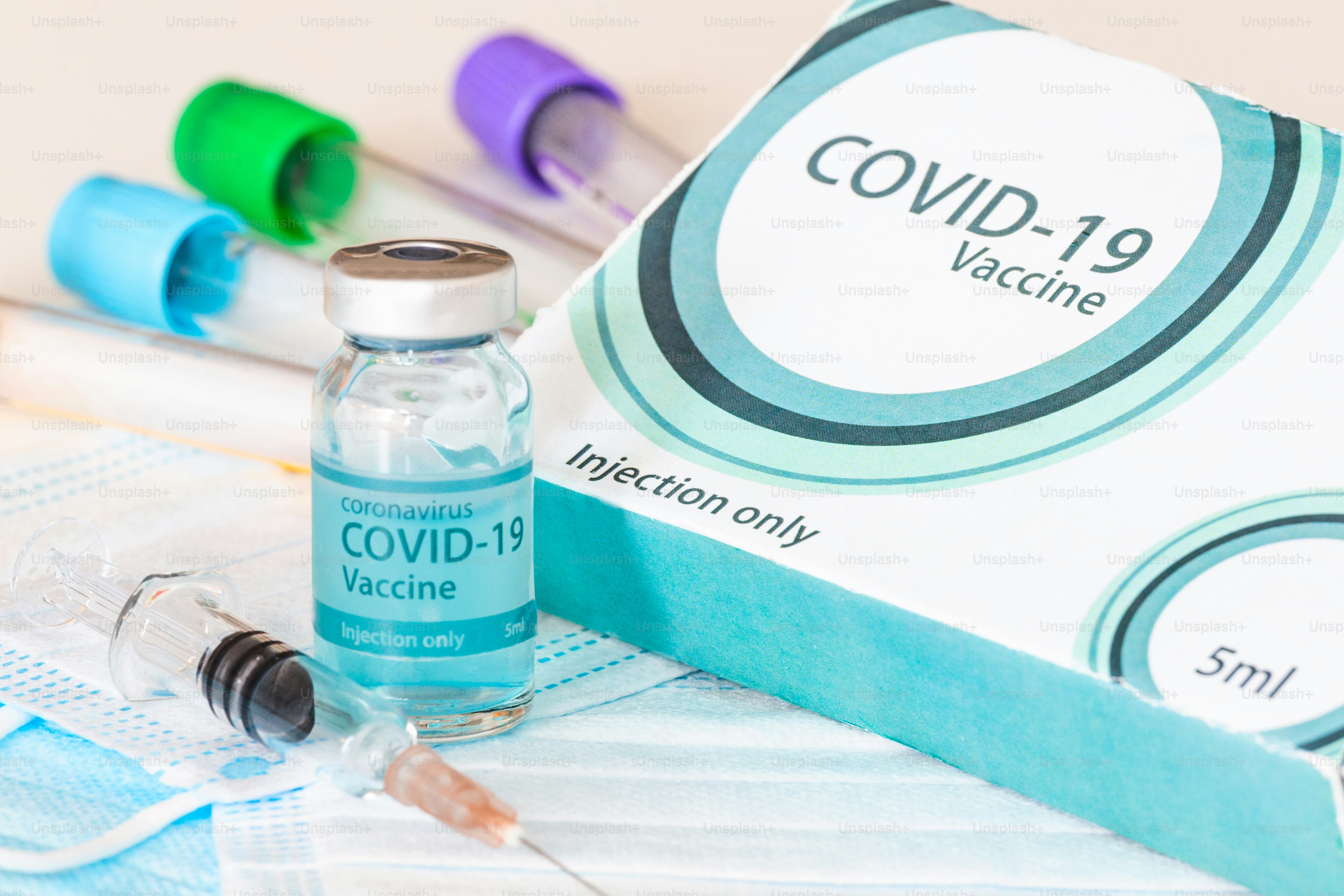 Medical bottle, vials, syringes and face mask. Coronavirus Vaccine - New vaccine against Coronavirus Sars-Cov-2 on the laboratory table. Vaccination session and immunity improvement.