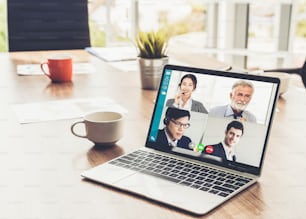 Video call business people meeting on virtual workplace or remote office. Telework conference call using smart video technology to communicate colleague in professional corporate business.