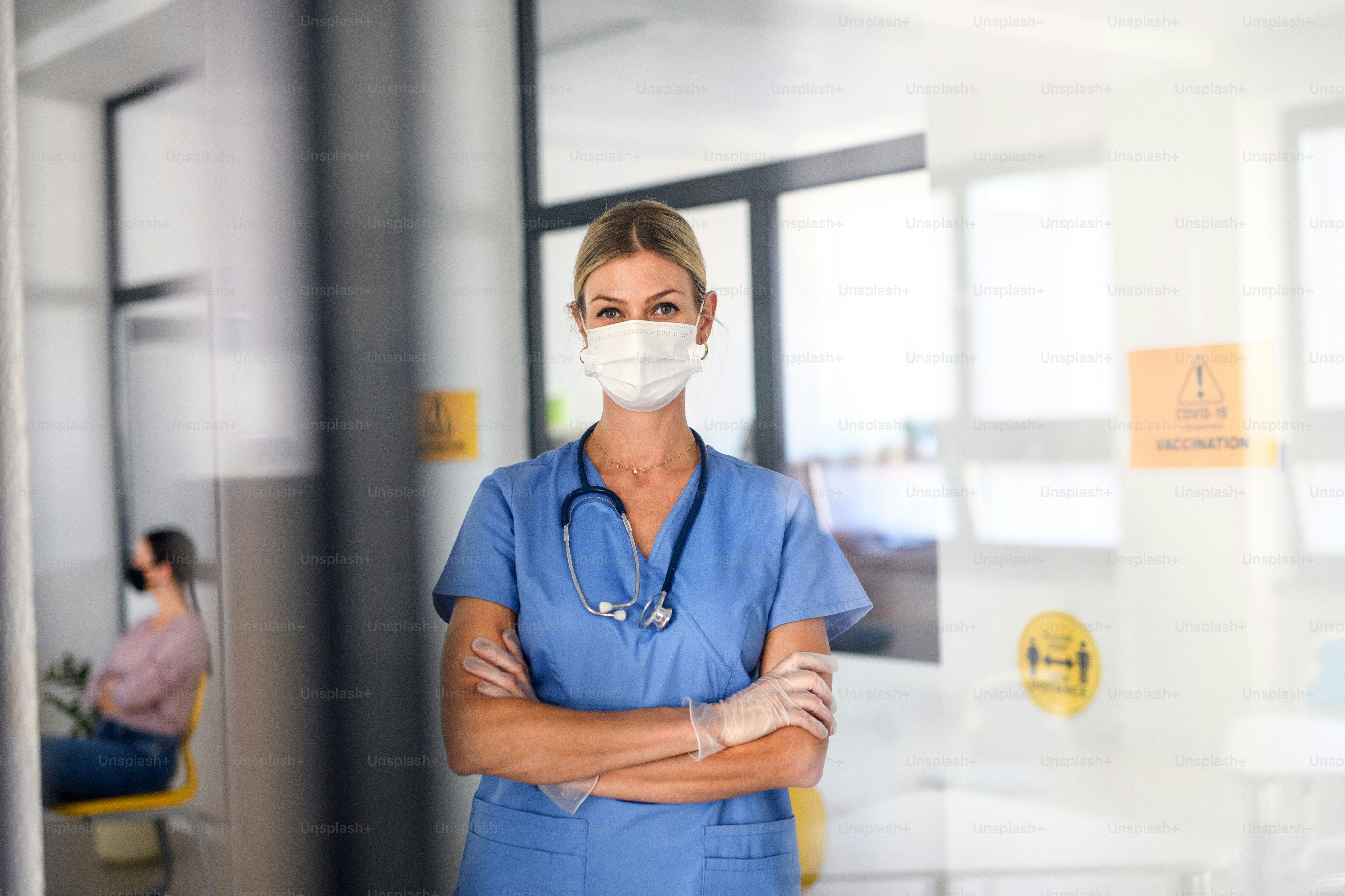 Portrait of nurse with face mask looking at camera, coronavirus, covid-19 and vaccination concept.