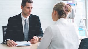 Job seeker in job interview meeting with manager and interviewer at corporate office. The young interviewee seeking for a professional career job opportunity . Human resources and recruitment concept.