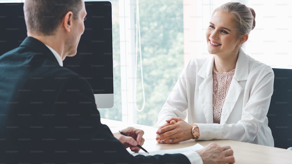 Job seeker in job interview meeting with manager and interviewer at corporate office. The young interviewee seeking for a professional career job opportunity . Human resources and recruitment concept.