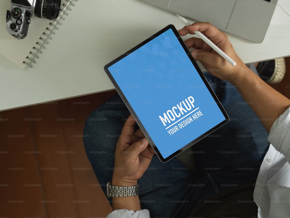 Overhead shot of male office worker using digital tablet include clipping path on worktable