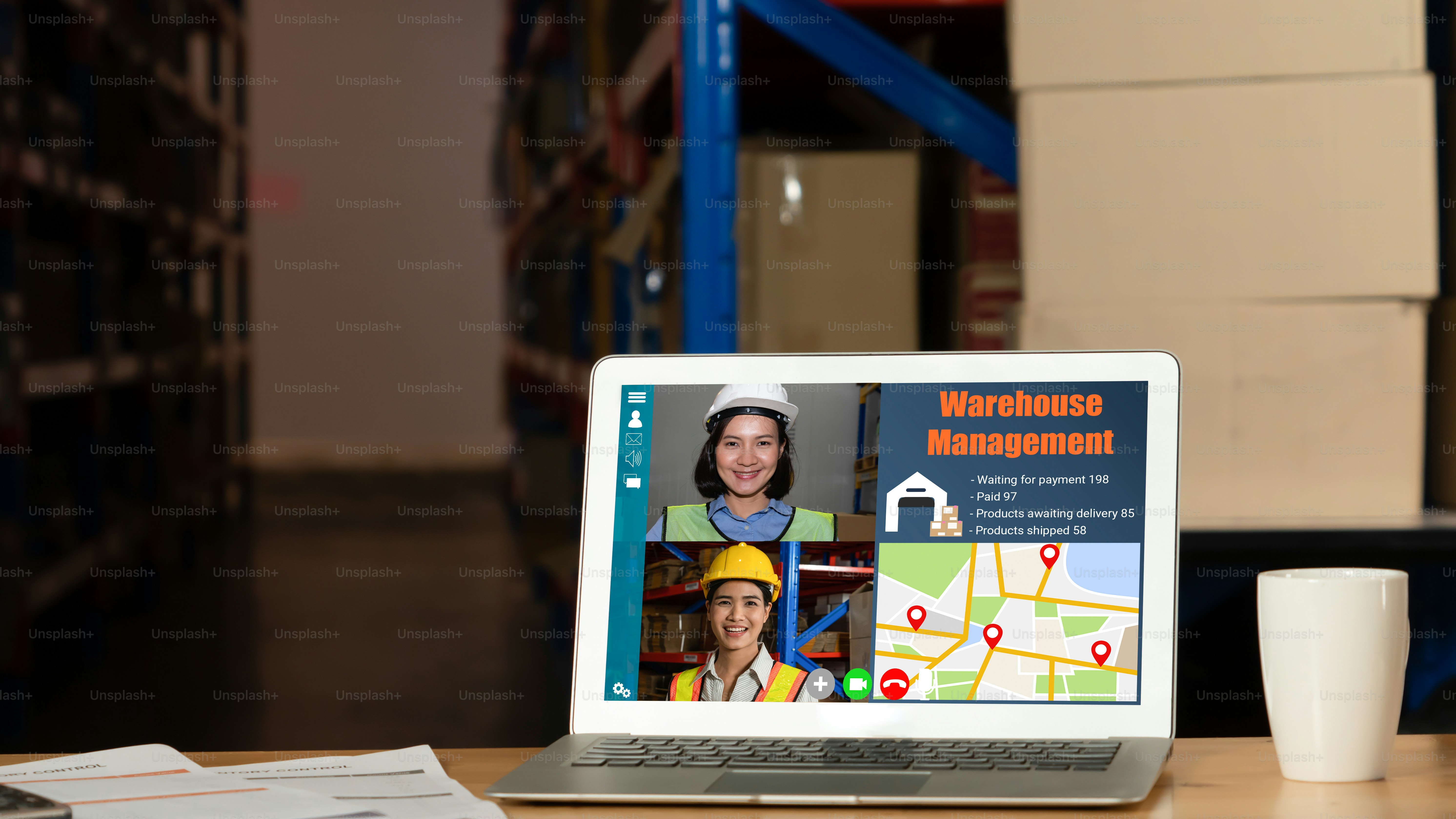 Warehouse staff talking on video call at computer screen in storage warehouse . Online software technology connects people working in logistic factory by virtual conference call on internet network .