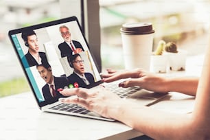 Video call business people meeting on virtual workplace or remote office. Telework conference call using smart video technology to communicate colleague in professional corporate business.