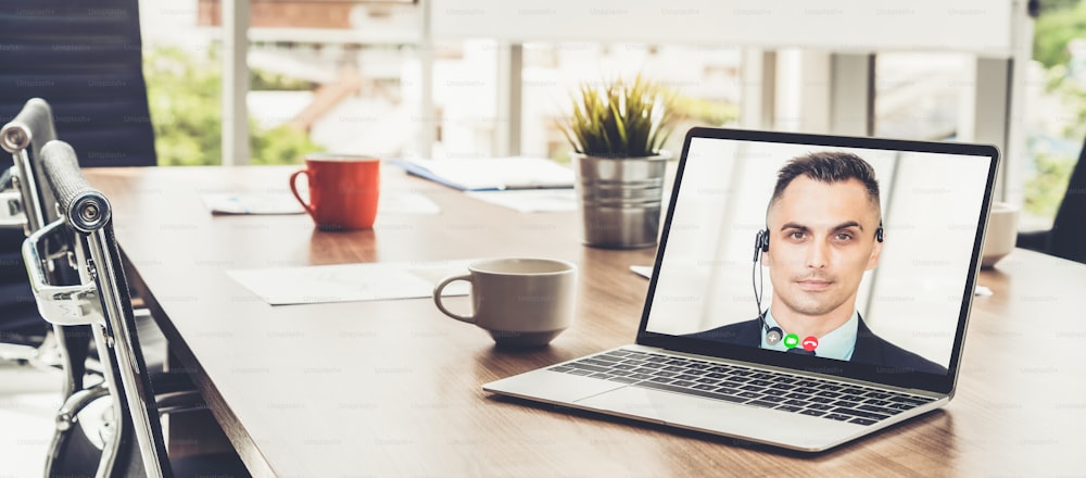 Video call business people meeting on virtual workplace or remote office. Telework conference call using smart video technology to communicate colleague in professional corporate business.