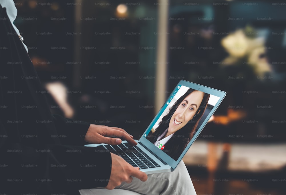 Video call business people meeting on virtual workplace or remote office. Telework conference call using smart video technology to communicate colleague in professional corporate business.