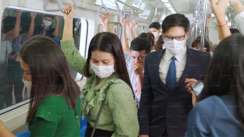 Sick man on train cough and make other people feel worry about virus spreading . Coronavirus COVID 19 pandemic and public transportation trouble concept .