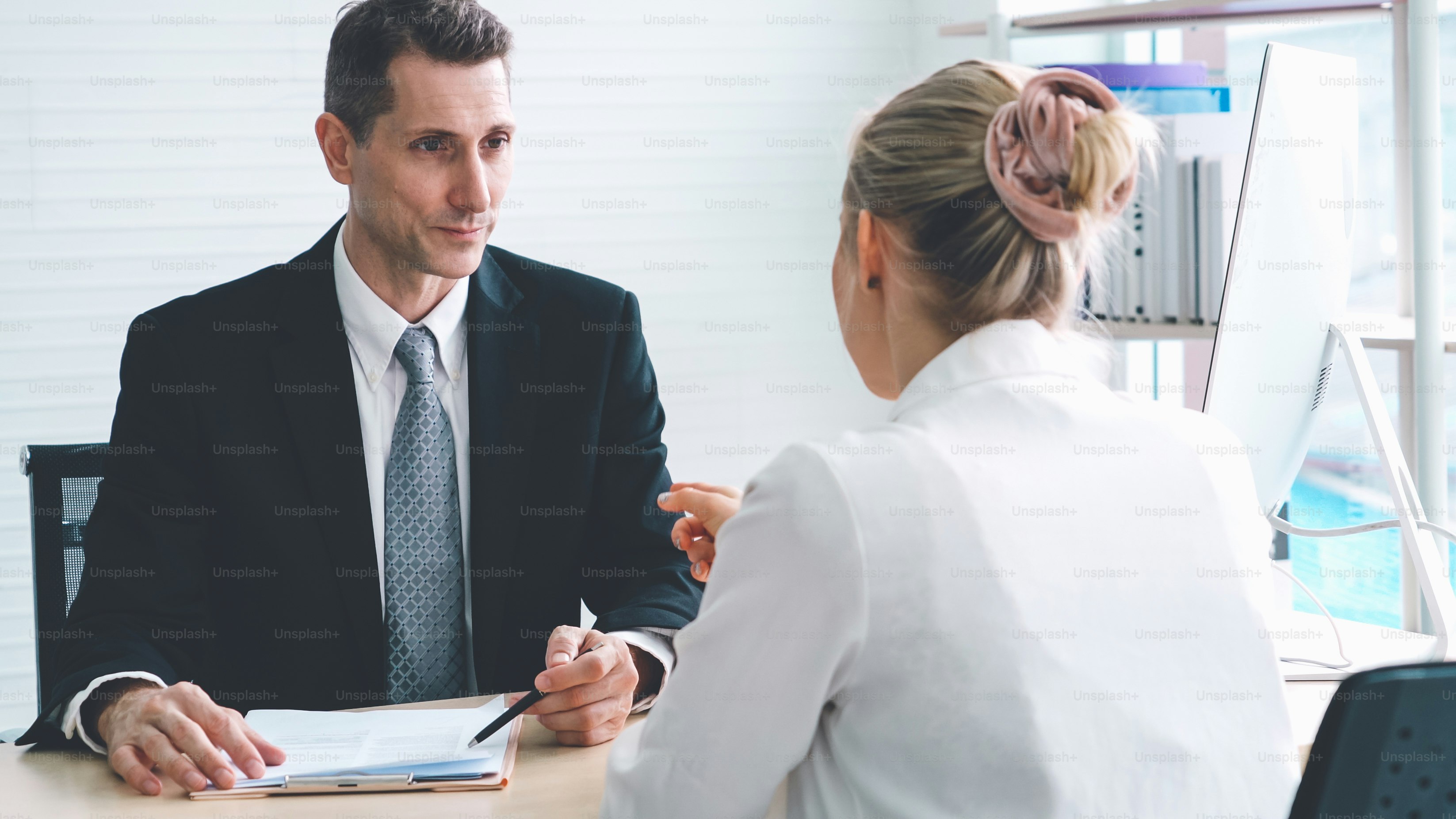Job seeker in job interview meeting with manager and interviewer at corporate office. The young interviewee seeking for a professional career job opportunity . Human resources and recruitment concept.