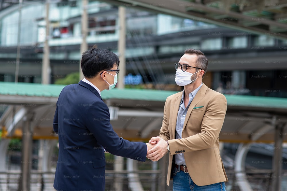 Businessman make handshake after success in business agreement.