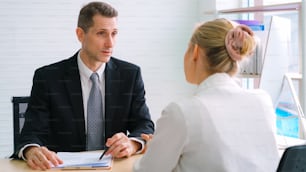 Job seeker in job interview meeting with manager and interviewer at corporate office. The young interviewee seeking for a professional career job opportunity . Human resources and recruitment concept.