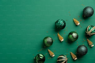 Green baubles and golden Christmas trees on green background. Christmas banner mockup, greeting card design