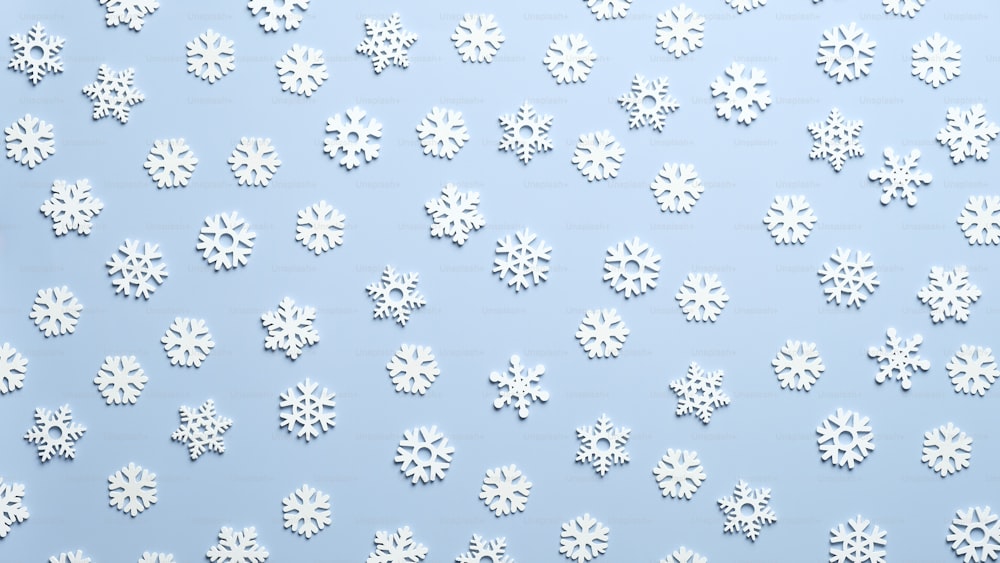 Weiße Schneeflocken Weihnachtsschmuck auf blauem Hintergrund. Muster von Schneeflocken, Weihnachtskarte.