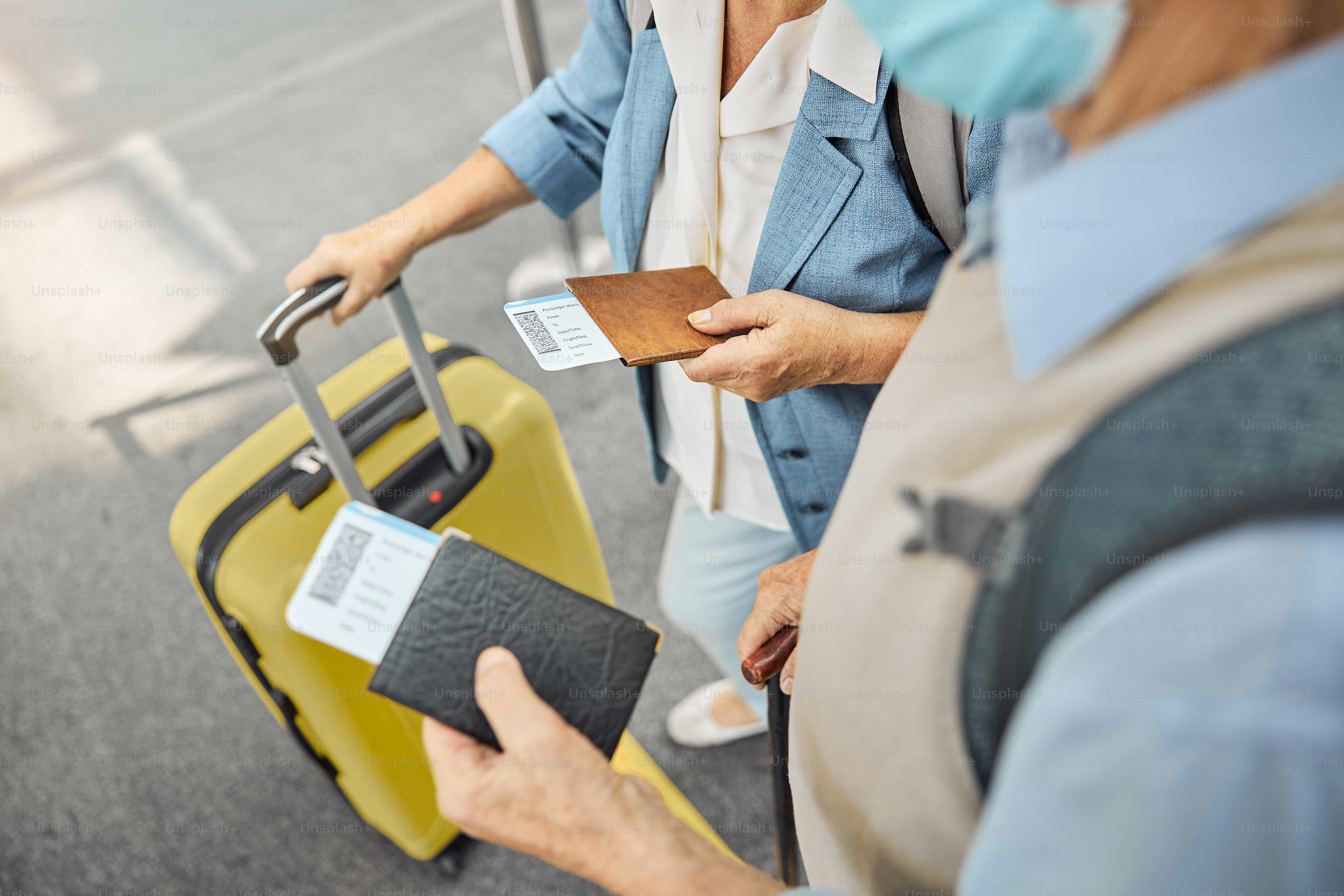 Cropped photo of a man in a face mask and a Caucasian woman standing at the airport