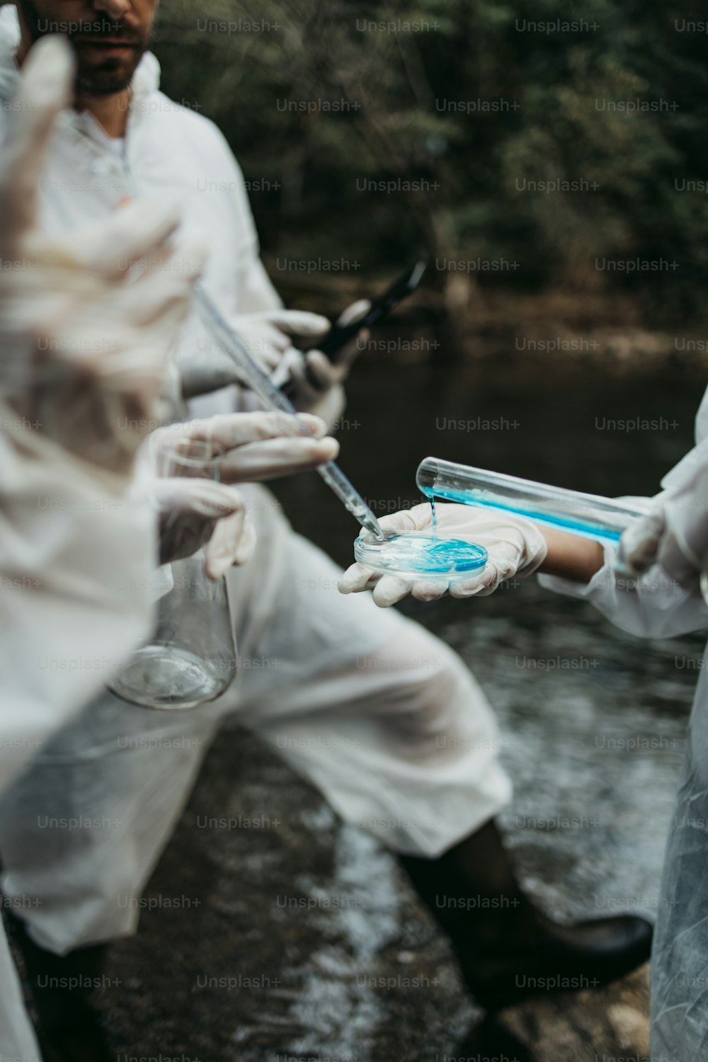Team of scientists and biologists researching possibilities for bacteria and virus spreading through natural flowing supplies of drinking water.