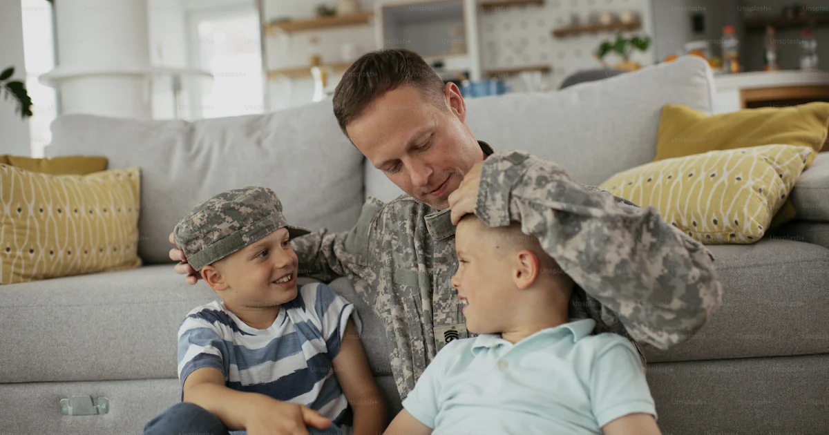 Soldier Fun Happy soldier sitting on the floor with his family. Soldier enjoying at ...