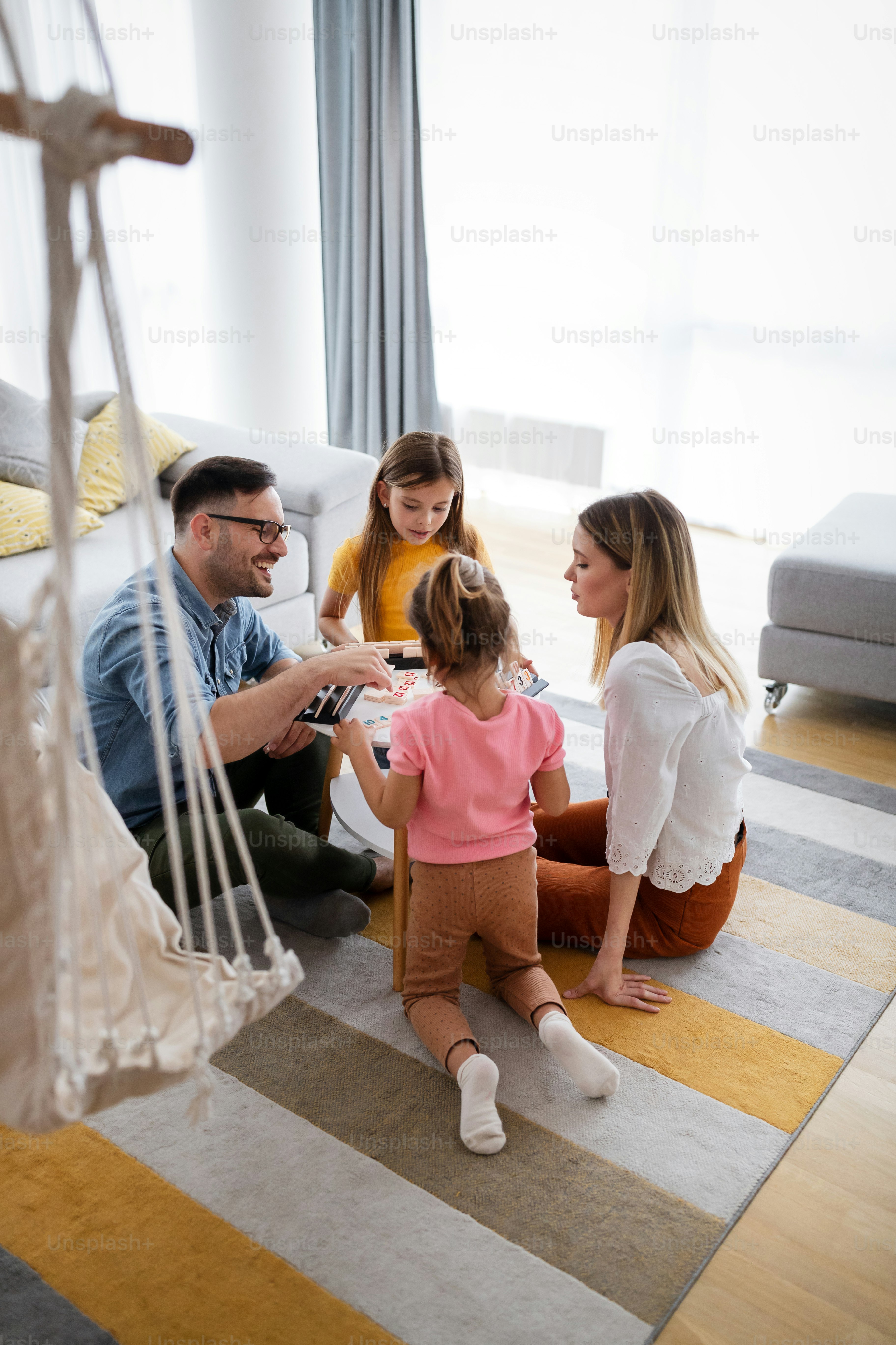 Happy beautiful family at home having fun and spending time together. Family, love happiness concept